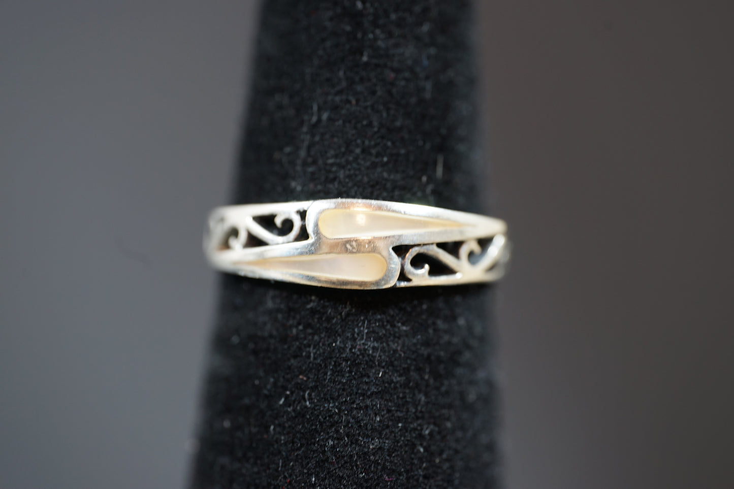 Silver Ring With Intrecate Band Design And Two Gemstones