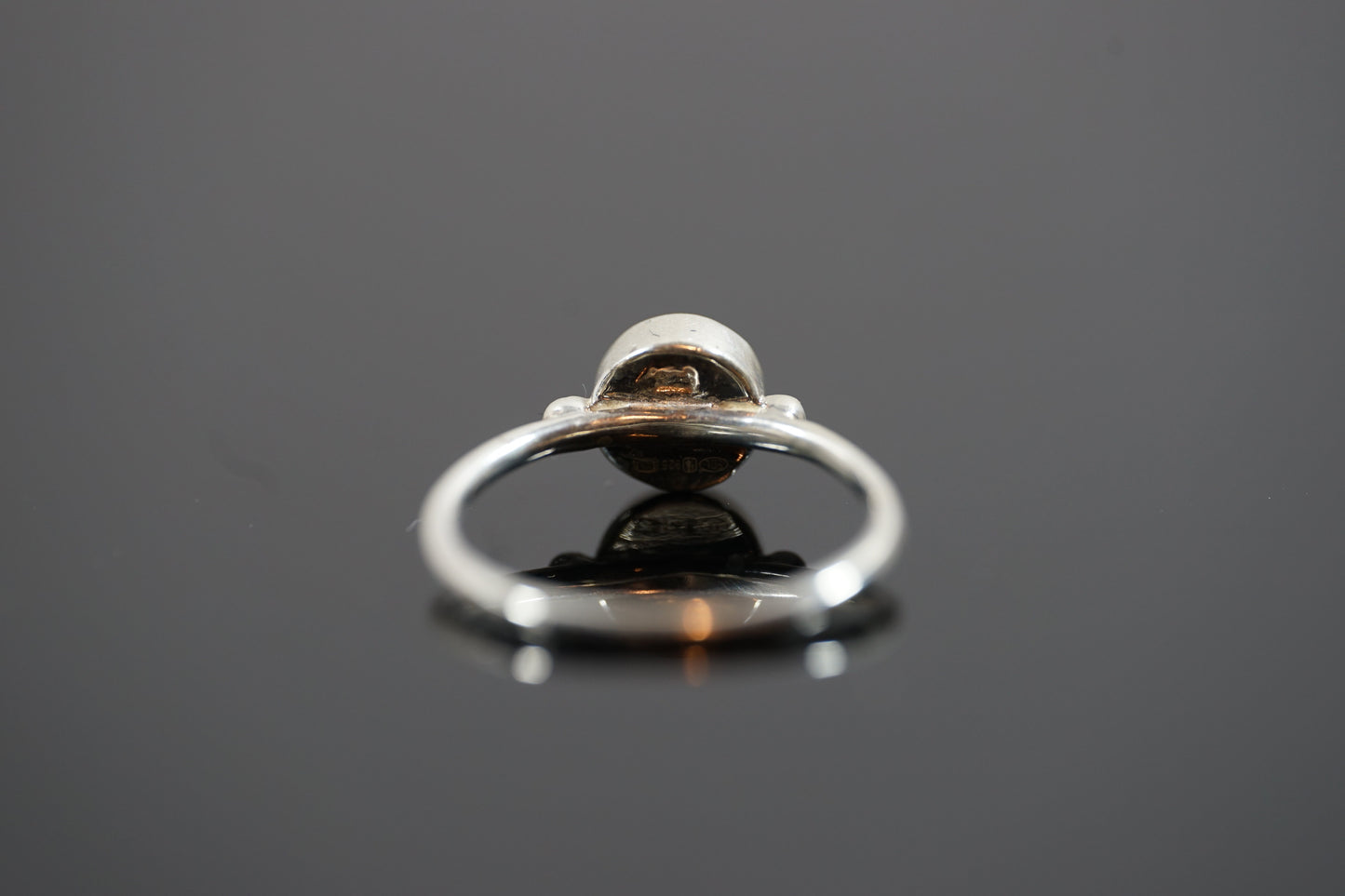 Silver Ring With Round Gemstone Between Two Silver Dots