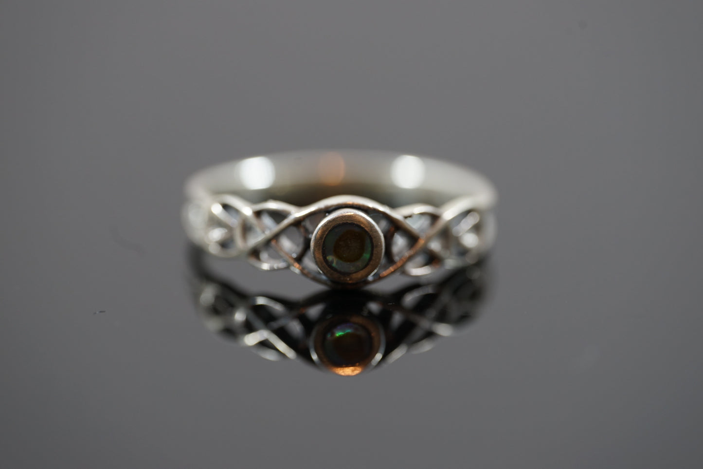 Silver Ring With Gem Stone And Intricate Band Design