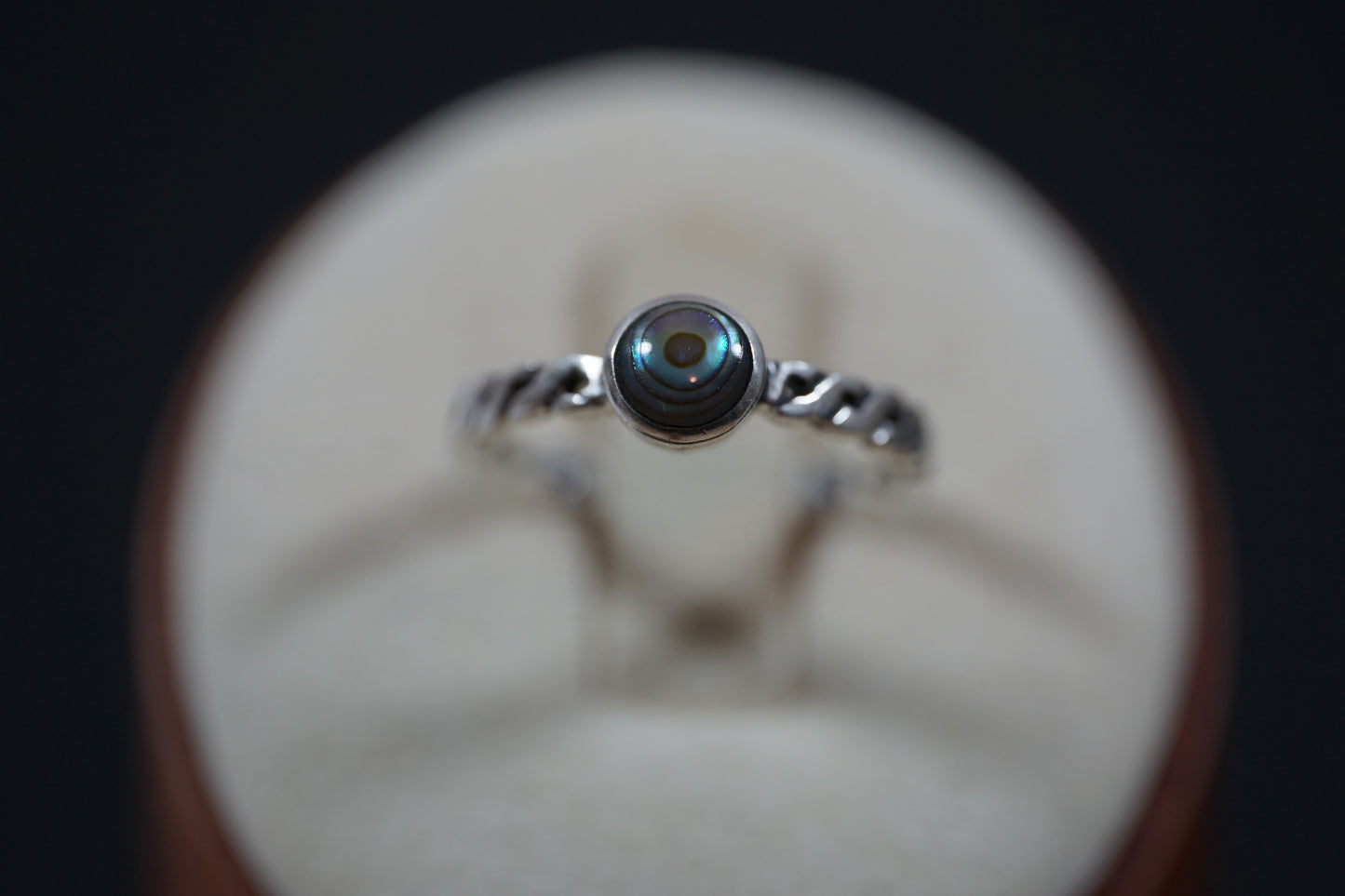 Silver Ring With Round Gemstone And Braided Band Design