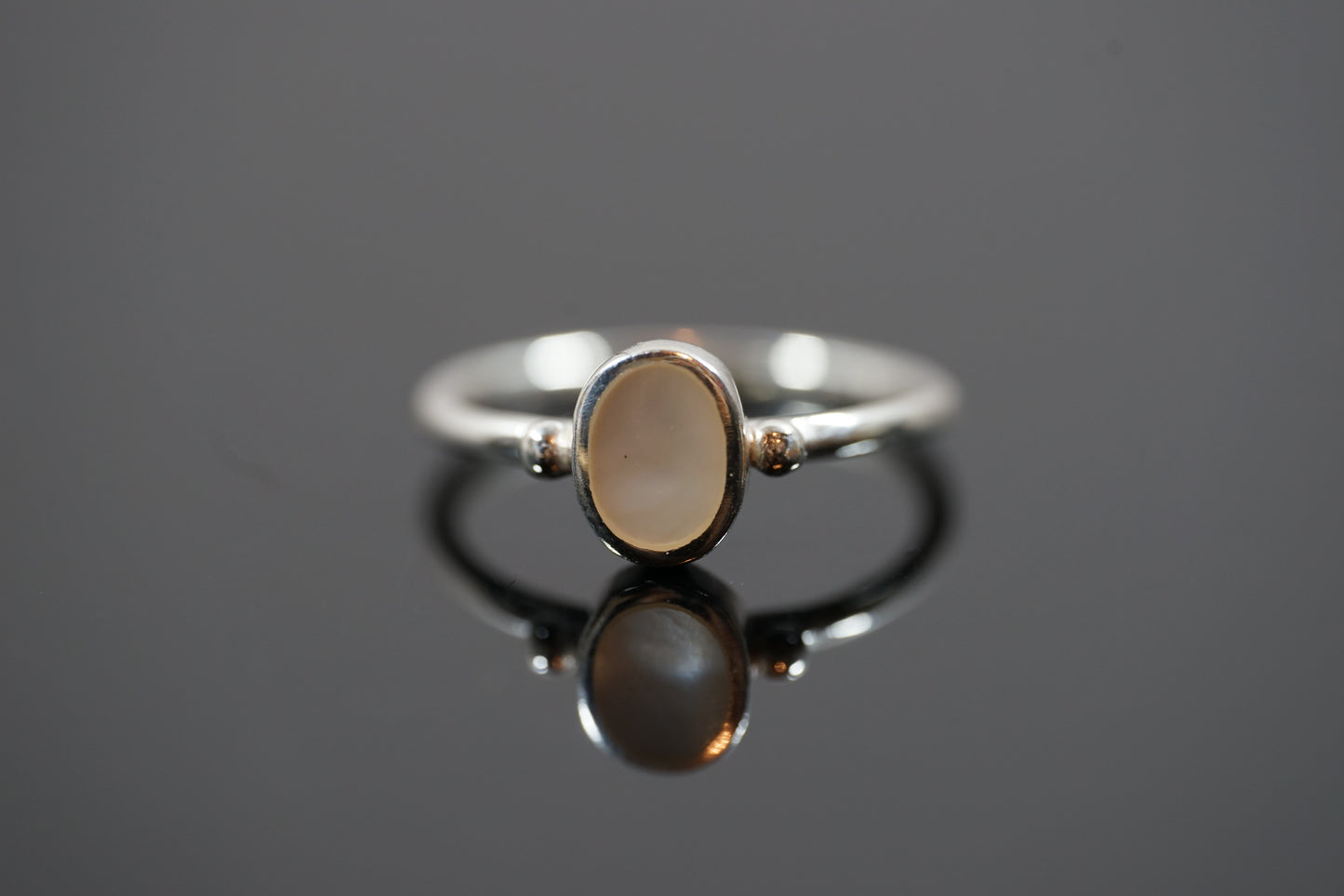 Silver Ring With Oval Gemstone And Two Dots