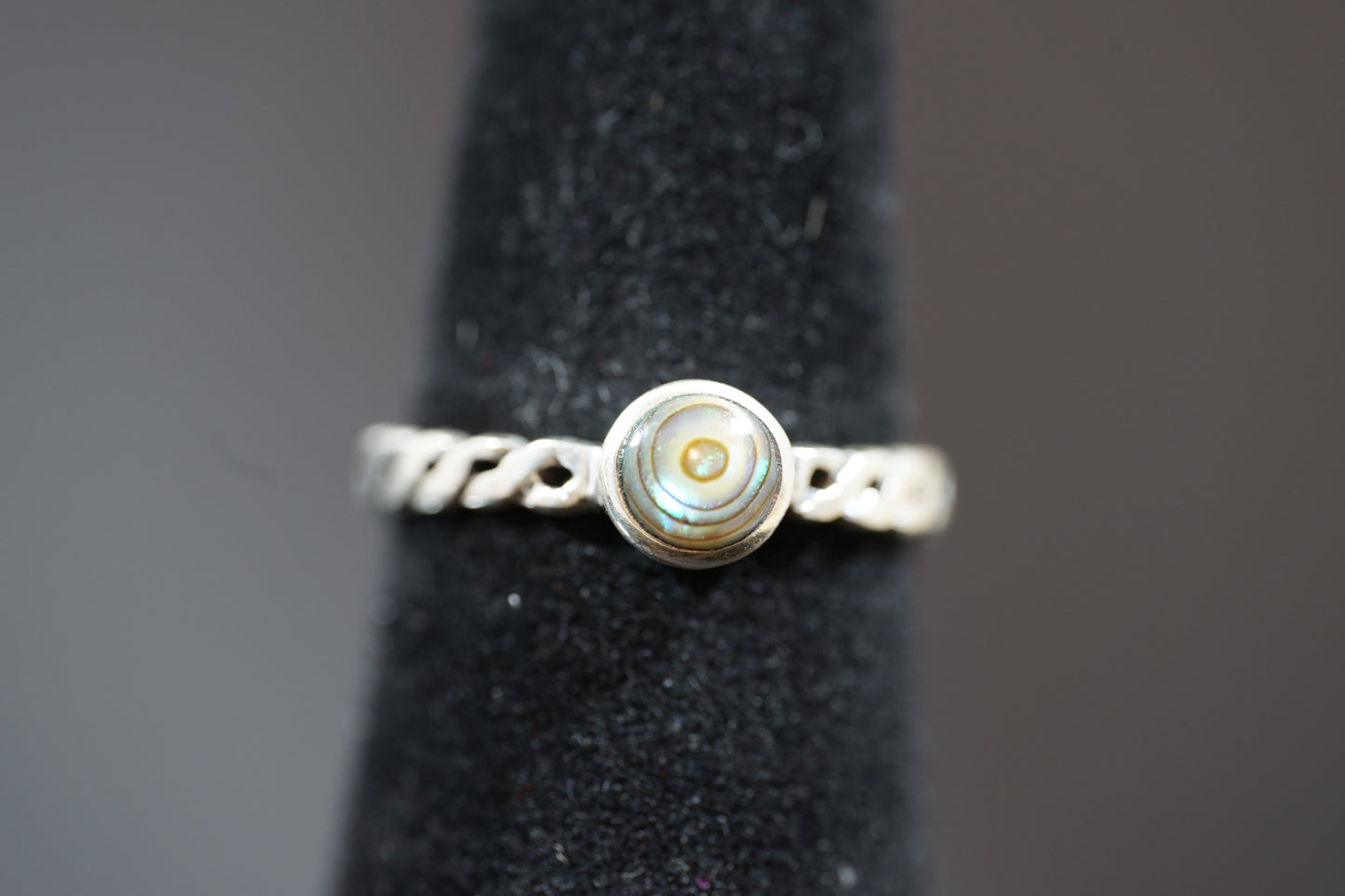 Silver Ring With Round Gemstone And Braided Band Design