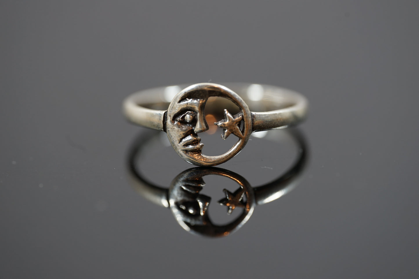 Silver Ring With Moon and Star Design