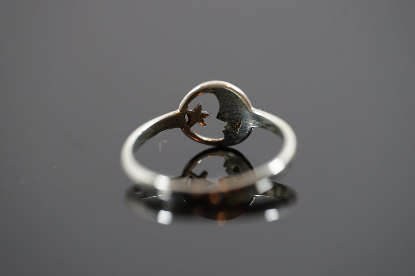 Silver Ring With Moon and Star Design